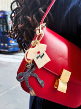 Load image into Gallery viewer, Solar Eclipse Hand-painted Coquette Bow Bag Charm + Keychain