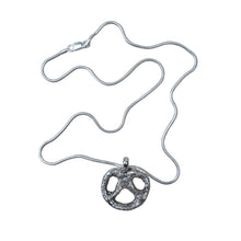 Load image into Gallery viewer, Sterling silver necklace with a pretzel-shaped pendant.
