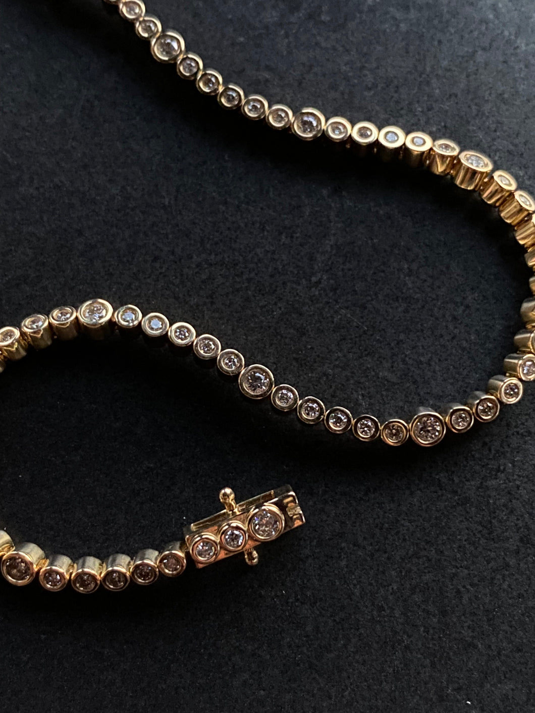 14K GOLD TENNIS BRACELET, BEZEL SET DIAMONDS 1CT