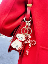 Load image into Gallery viewer, Solar Eclipse Hand-painted Coquette Bow Bag Charm + Keychain
